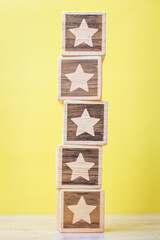 star symbol block on yellow background. Service rating, ranking, customer review, satisfaction,...