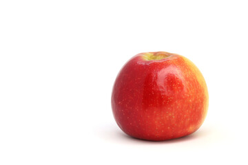 The red apple is isolated on a white background with no shadow