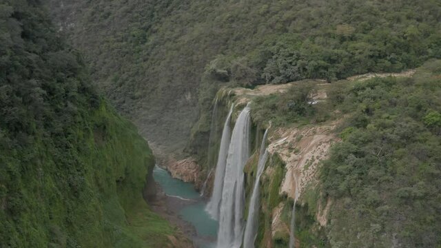 Aerial dolly in with a tilt down in the Tamul Waterfall