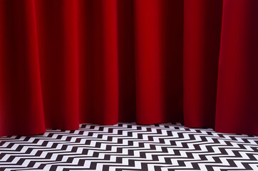 Theatre scene with red velvet curtain and black and white tile on floor. Stage for displaying product in twin peaks style.