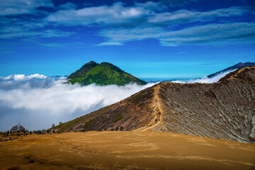 Fototapeta na wymiar Landscape of mountains amount fog in Kawah Ijen volcano, Java, Indonesia.