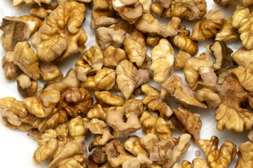 Peeled walnuts on a plate.