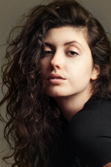 Naklejka premium Portrait of a young emotional beautiful curly girl. Photography tests for an actress 