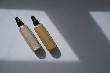 body cream with gold and white glitters for a radiance effect on a white background top view. skin lining glitter effect on the skin. cosmetics mockup