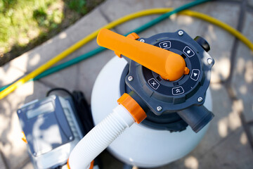 Clear the sand filter of the pool. Service and maintenance of the swimming pool. Washing of filter...