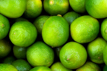 Lemon lime green fruit. Close-up background image. Illustration for the harvest period, agriculture, different types of fruits.