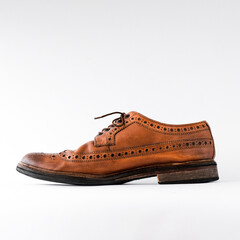brown men's brogues on a white background close-up. classic men's shoes. mockup