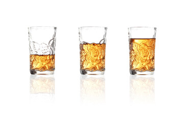 whiskey in shot glass on white background