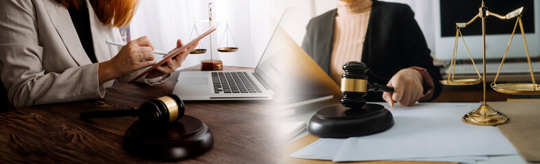 Justice and law concept.Male judge in a courtroom with the gavel, working with, computer and docking keyboard, eyeglasses, on table in morning light