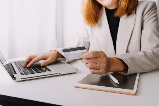 shopping online payment by using laptop.hands holding credit card and using laptop. online shopping concept.
