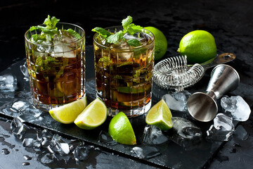 Cuba libre cocktail in  glass on  dark table