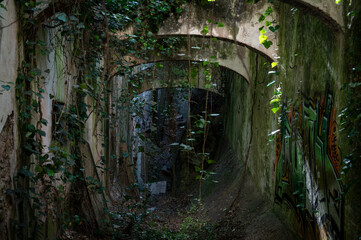 Old abandoned building in ruins, it is a dangerous site with graffiti