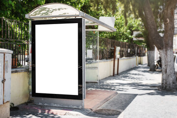 White blank vertical advertising billboard on street bus stop
