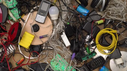 E-waste and Hazardous waste sorting and disposal. Old broken phones, battery, computers and electronics. Heavy metal pollution. Used electrical devices and obsolete electronic equipment - Powered by Adobe