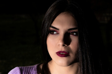 portrait of young woman in a wool sweater outdoors