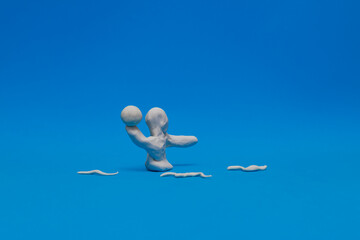 Fototapeta na wymiar A white modeling clay dummy practicing water polo