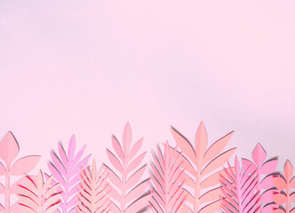 Summer background with colorful paper tropical leaves.