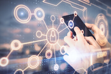 Double exposure of man's hands holding and using a phone and social network theme drawing.