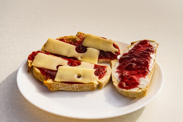 Breakfast. Bread slices with jam and cheese