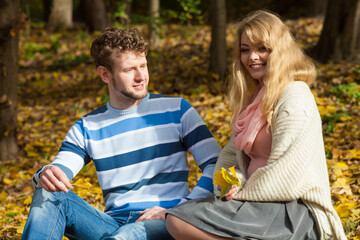 couple relaxing in autumn park