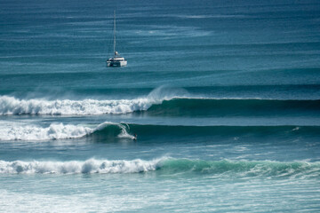 Surfer on perfect blue wave, in the barrel, clean water, Indian Ocean