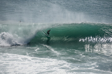 Surfer on perfect blue wave, in the barrel, clean water, Indian Ocean .