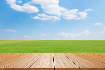 empty new wood table and green field