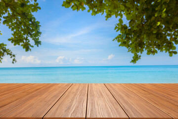empty new wood table and tropical blue sea in background