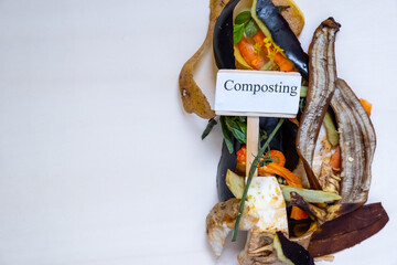 Organic food waste. Paper bag with vegetable leftovers for compost