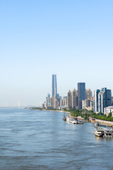 Fototapeta premium Wuhan skyline and Yangtze river with supertall skyscraper under construction in Wuhan Hubei China.