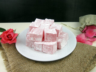 Turkish delight, rose flavored Turkish delight on the plate.