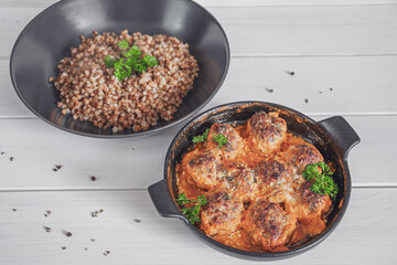meatballs with cheese and buckwheat porridge garnish