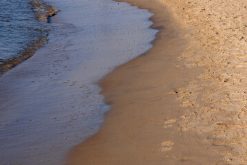 Soft wave of the sea on the sandy beach.Soft focus,blurred image.