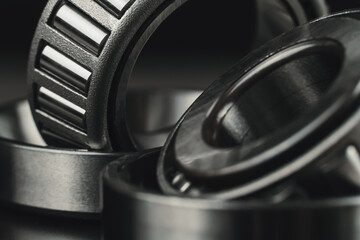 Two new car bearings on a black background macro photo