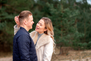Fototapeta premium Happy loving couple enjoying of happiness love and tenderness, dating, romance.Couple hugging in love at spring park.