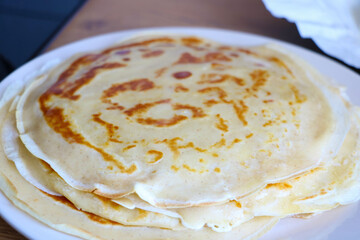 Plate with fresh baked pancakes for breakfast.