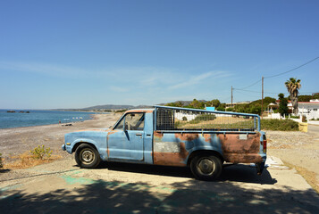 Old Pickup truck on the beach of Kiotari, Rhodes, Greece