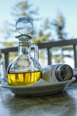 Traditional bottle of olive oil with salt in front of the cedars of Lebanon