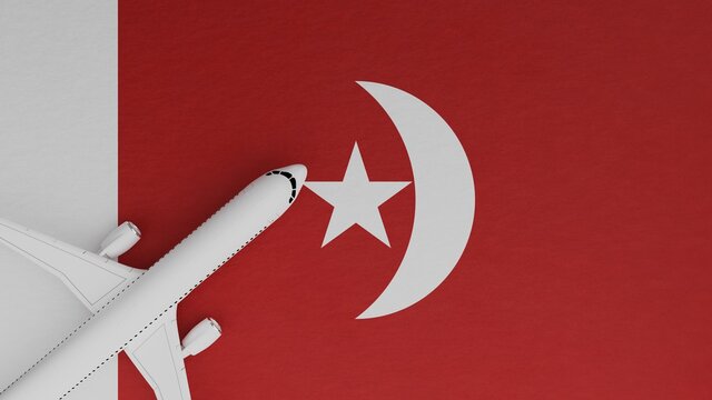 Top Down View Of A Plane In The Corner On Top Of The Flag Of Umm Al-Qaiwain