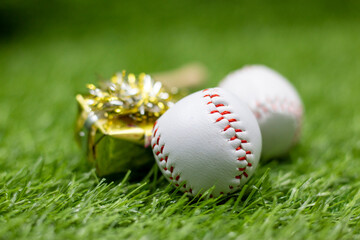 Baseball for Christmas Holiday with ball and gift on green grass