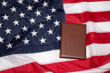 American Flag with brown blank book. Flag of the USA. Memorial Day. Independence Day 4th of July