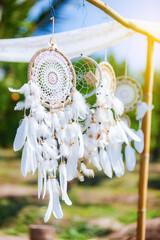 dreamcatcher hanging in the wind at evening
