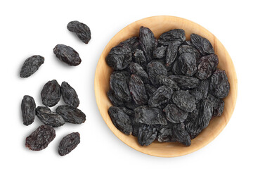 Black raisin iin wooden bowl solated on white background with clipping path. Top view. Flat lay - obrazy, fototapety, plakaty