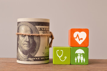 Life insurance concept. Money banknote with stethoscope, heart and family icons.