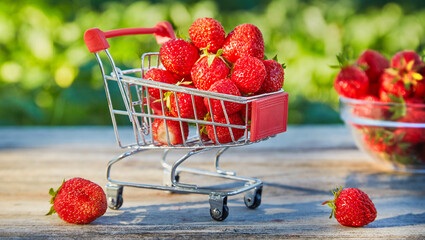 Ripe strawberries in a shopping cart.