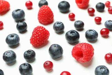 Delicious fresh berry mix on white background