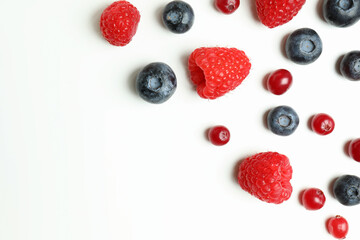 Delicious fresh berry mix on white background