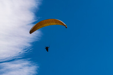 Paragliders against the blue sky.