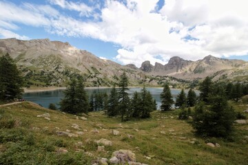 Fototapeta na wymiar Lake of Allos, Natural alpine lake, lacated in Mercantour National Park, Alpes-de-Haute-Provence, France. Dominated by Mont Pelat. It's the largest high altitude lake in Europe. Levedone