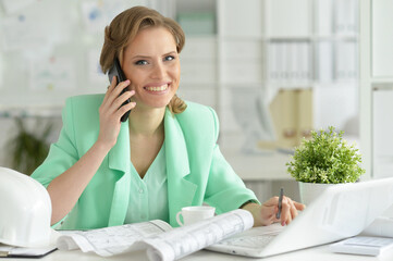 young architect  talking on phone